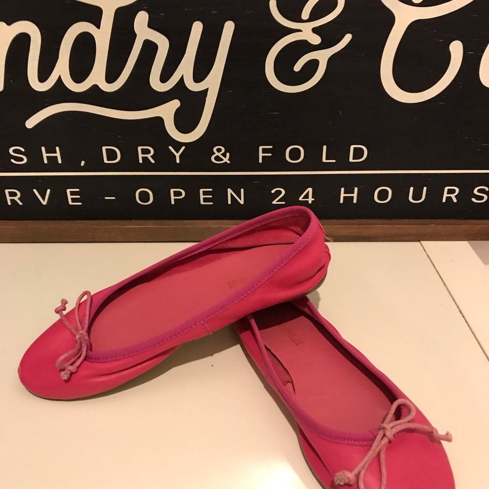 Pink leather flats.